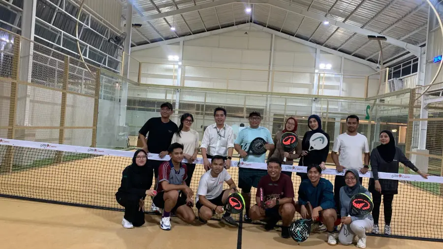 Group of players on court with rackets