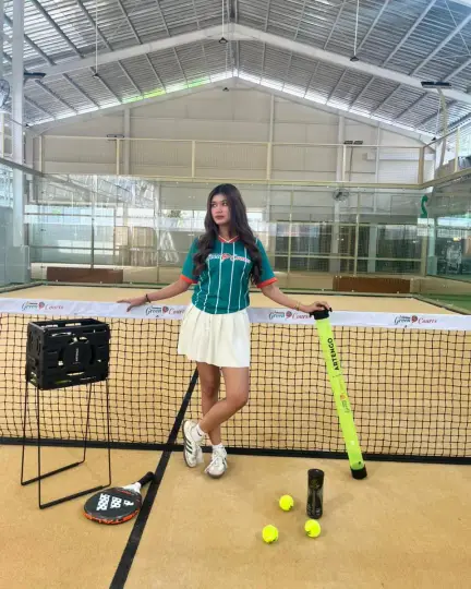 Player at the net on the sand-coloured court